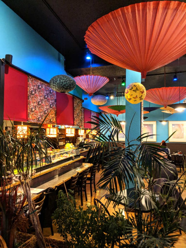 colorful parasols hanging from restaurant ceiling