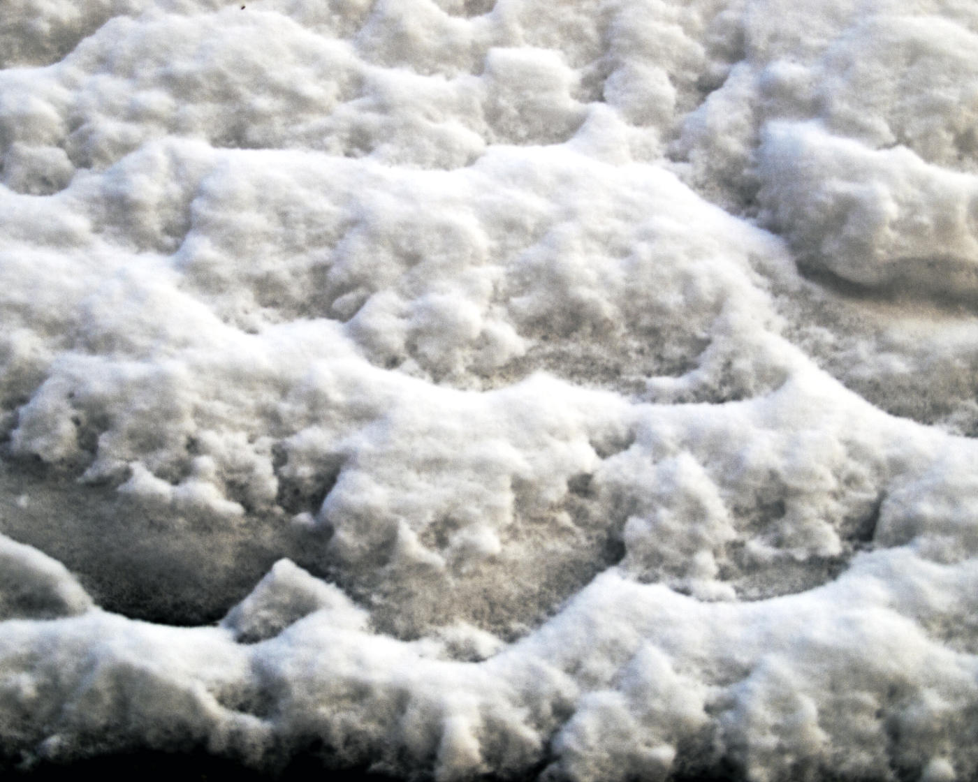 Gray and white patterns in closeup of snow