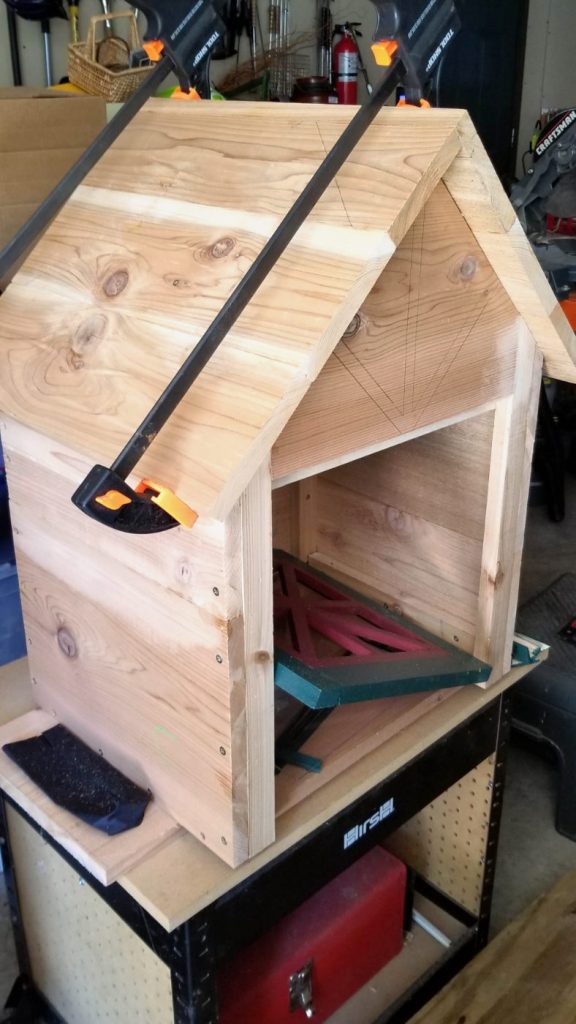 Wooden box with roof on a workbench