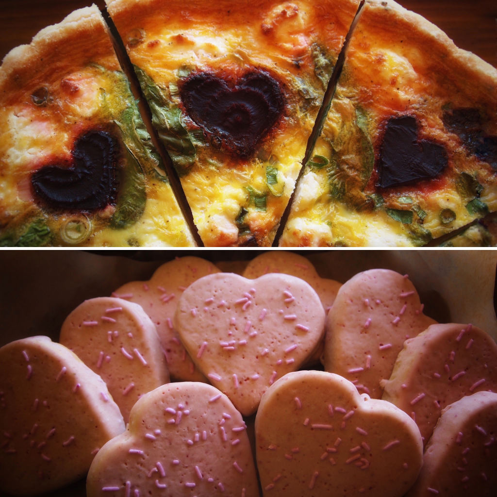 yellow quiche slices with dark red heart shapes and pink hear-shaped cookies
