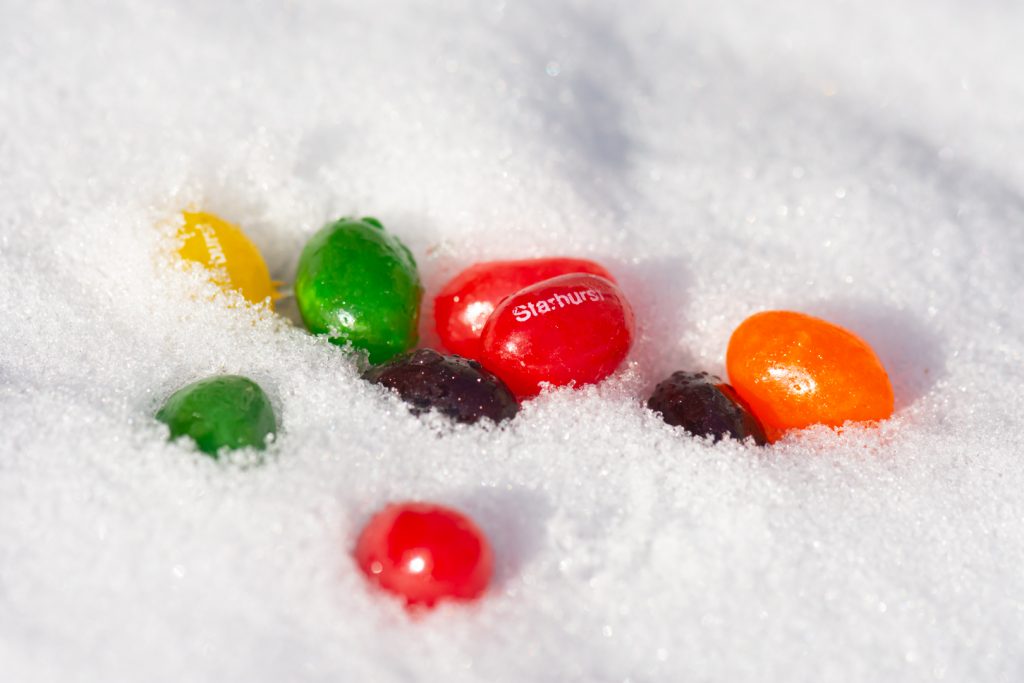 colorful jelly beans in snow