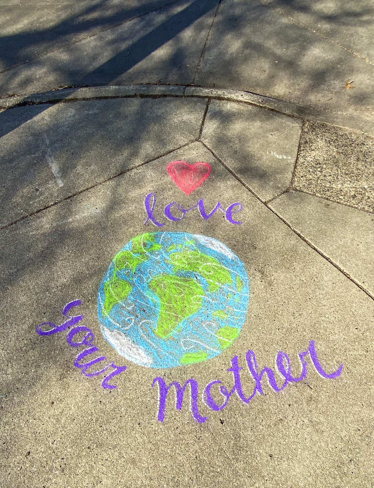 chalk art on cement sidewalk with a colorful earth globe, red heart, and the words: Love Your Mother